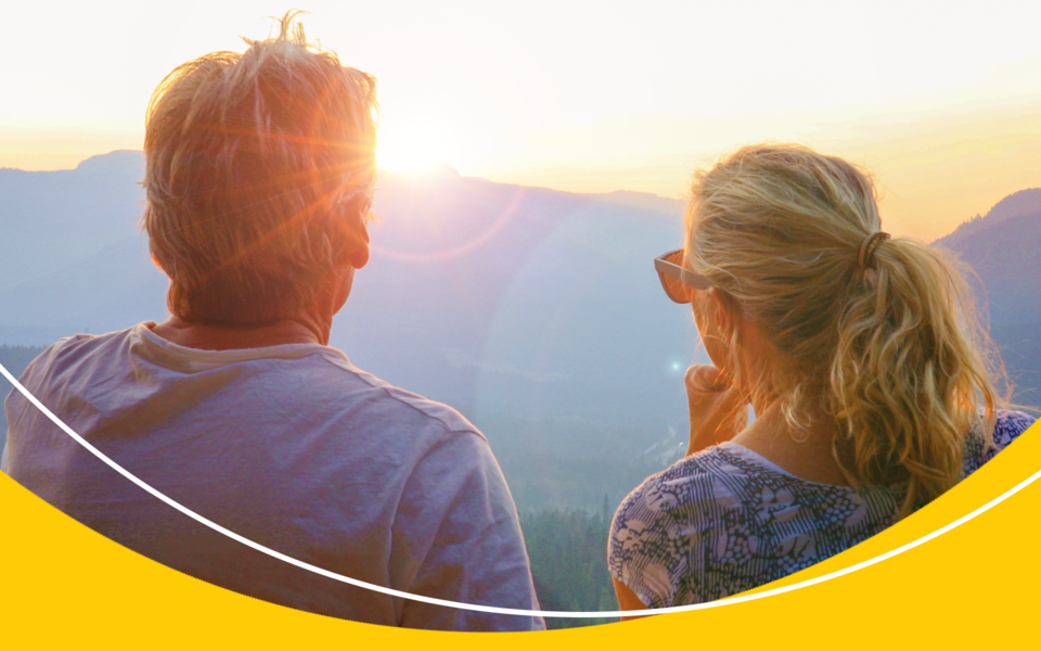 A couple sharing a view together with the beautiful sunset