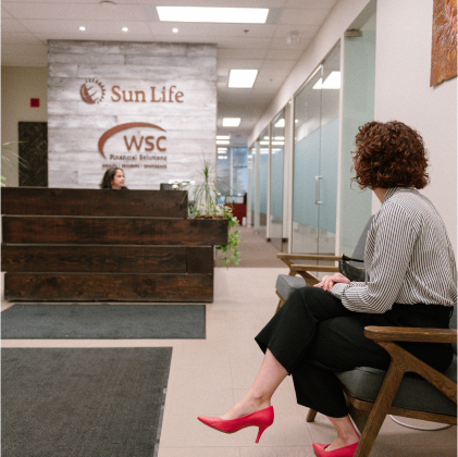 A young lady sitting at the front desk