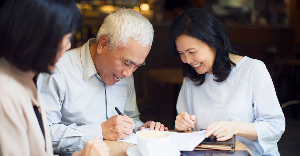A financial advisor helping an elderly couple