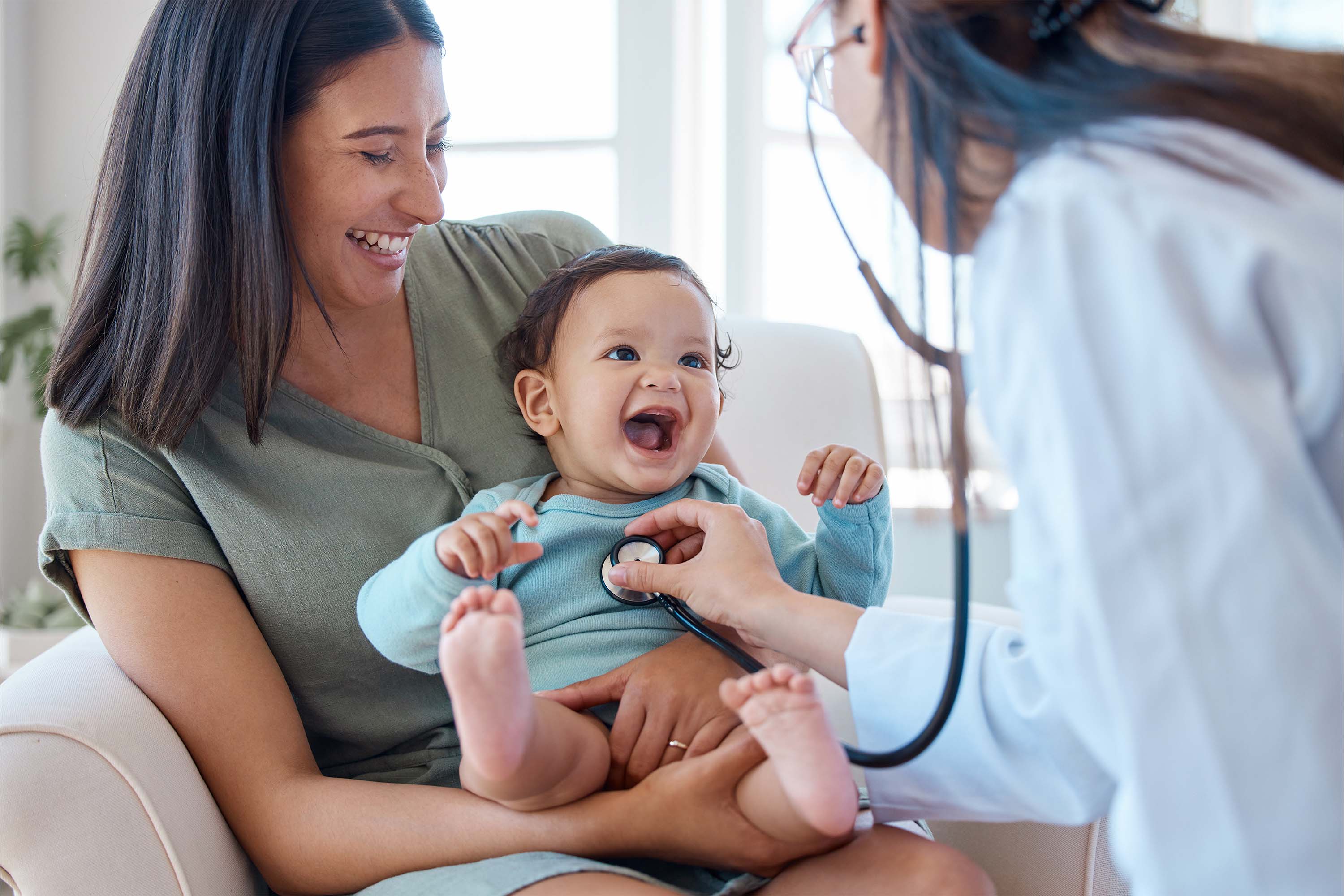 A lady doctor examining a child