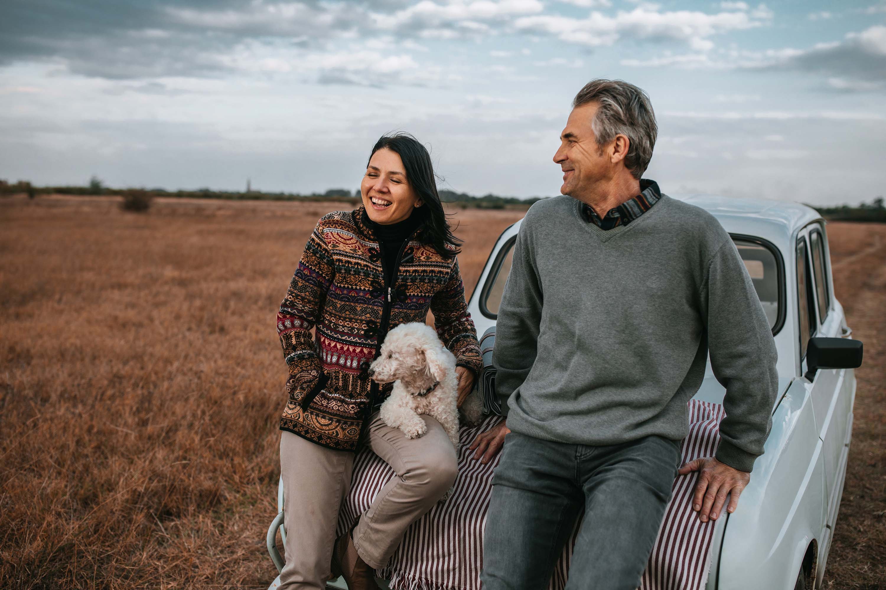 A man and woman speaking outdoor