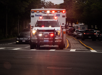 wide angle view of an ambulance driving on the street