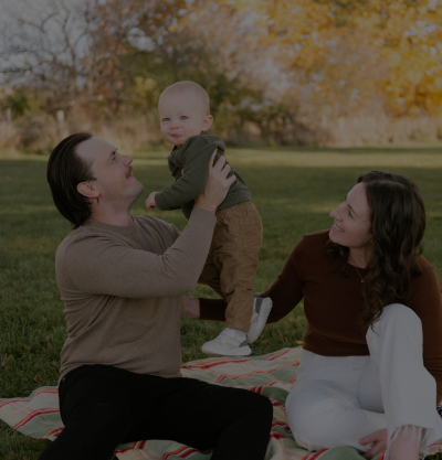 Family having a picnic in field