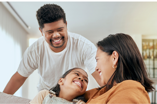 Family smiling together while discussing their financial future