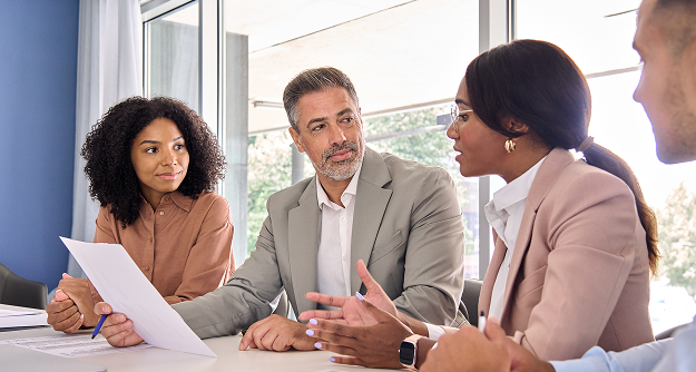 Financial advisors meeting with clients to discuss financial planning