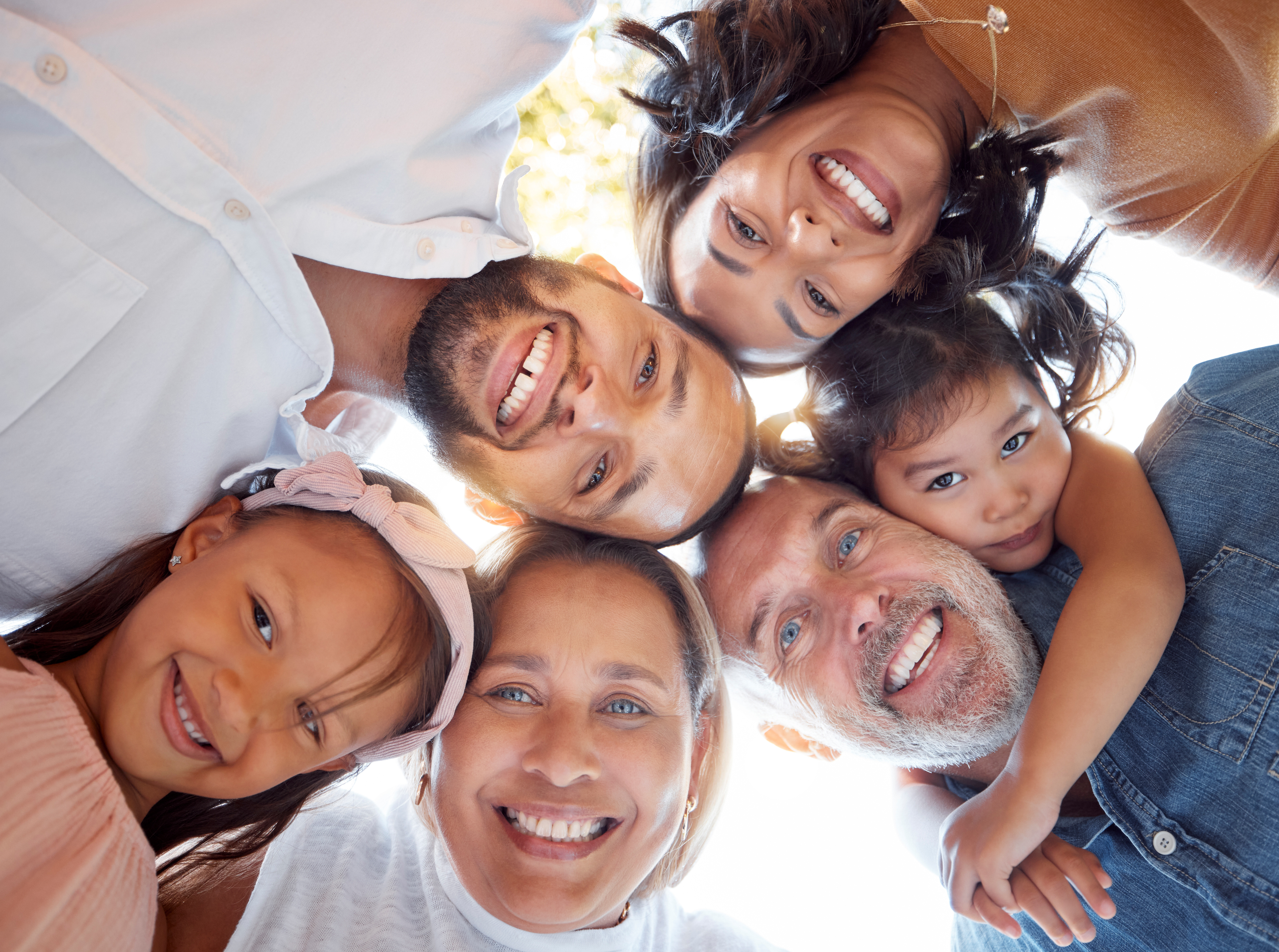 Multi-generational family smiling at the camera